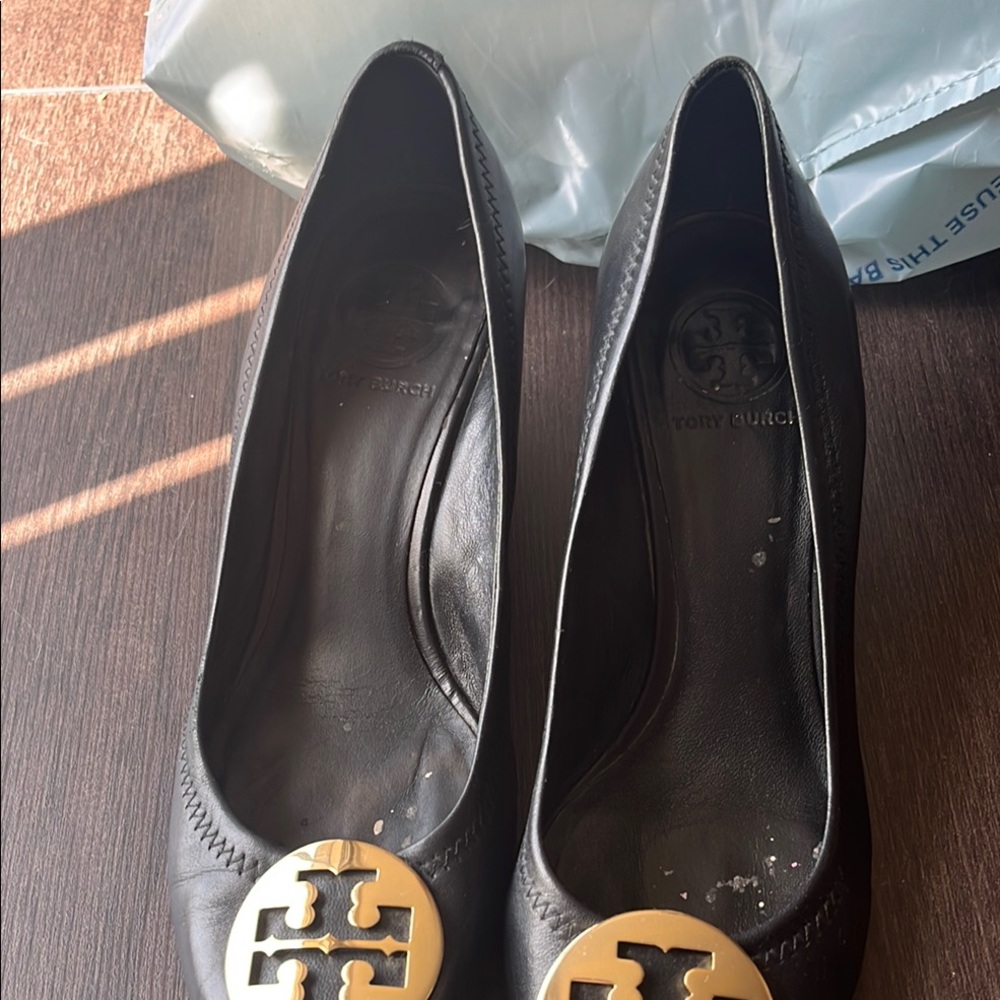 Tory Burch Black and Gold Flats with Signature Medallion